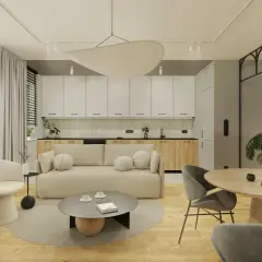 Nowoczesny salon z aneksem kuchennym, jasna sofa, okrągły stół, designerskie fotele i rośliny.
